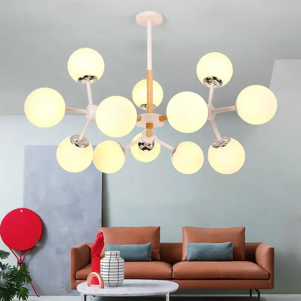 DecorBites contemporary globe chandelier with white glass and wood-toned arms is a dining room hanging light