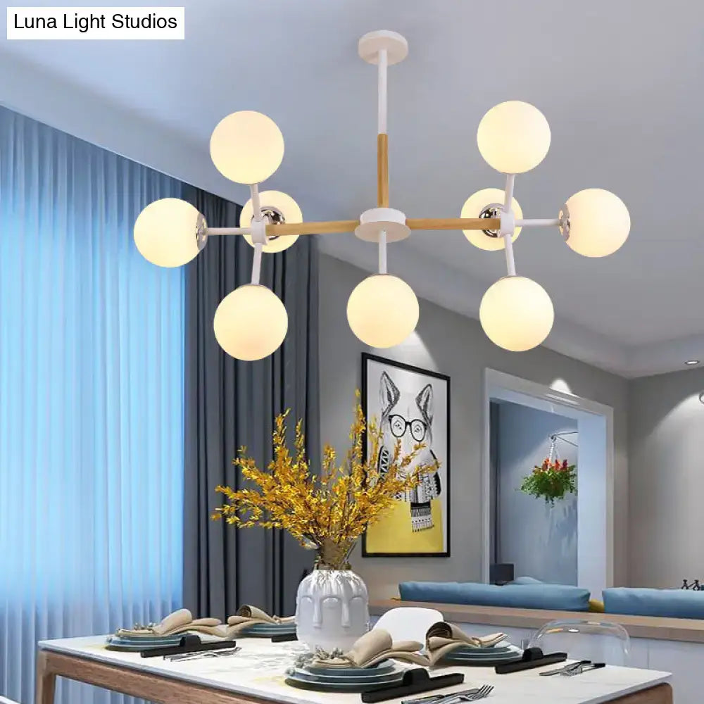 DecorBites contemporary globe chandelier with white glass frosted bulbs and light wood frame for dining room hanging light