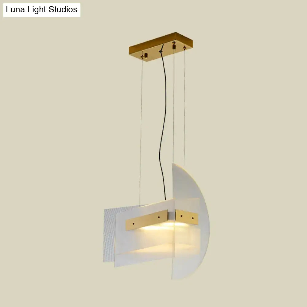 Modern pendant light with gold geometric chandelier design featuring frosted glass shades and brass accents for dining room