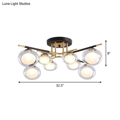 Decorbites semi-flush mount ceiling fixture with black base, gold metal arms, and clear glass oval shades for dining rooms