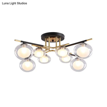 DecorBites™ semi-flush mount ceiling fixture with gold metal arms, black base, and oval glass shades for dining rooms