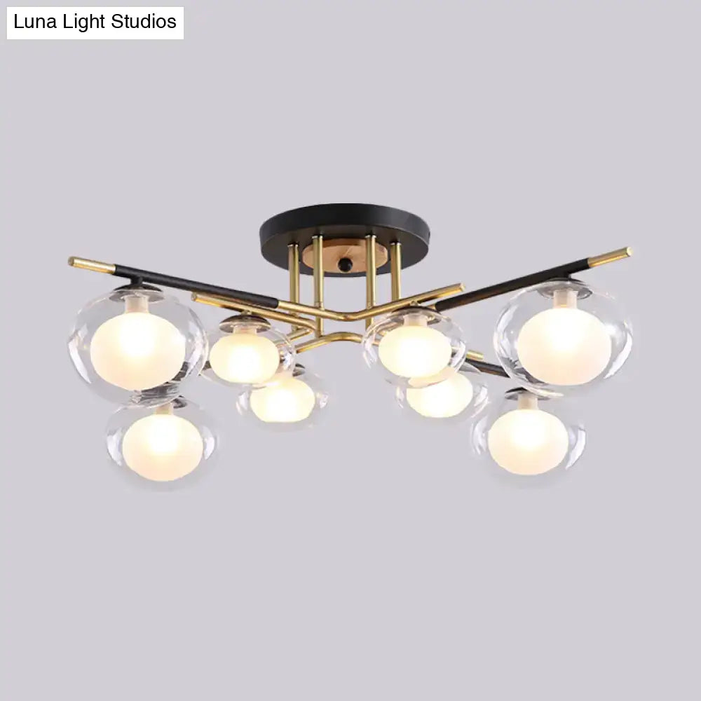 DecorBites™ semi-flush mount ceiling fixture with black and brass metal frame and oval shade glass globes
