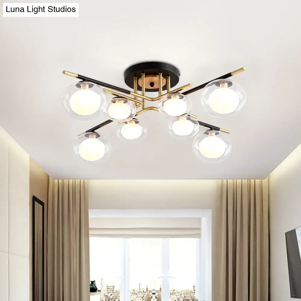DecorBites™ semi-flush mount ceiling fixture with oval shade featuring six clear glass globes on brass and black metal frame