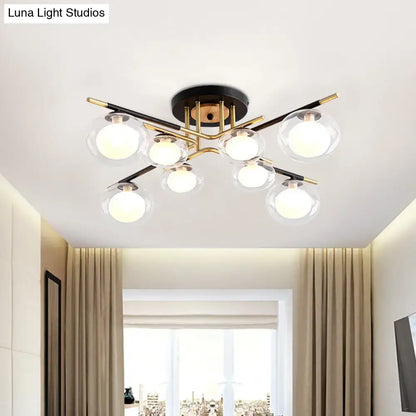 DecorBites™ semi-flush mount ceiling fixture with oval shade featuring six clear glass globes on brass and black metal frame