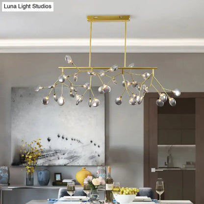 Gold-toned DecorBites heracleum island pendant light with branching arms and clear glass globe shades for modern dining rooms