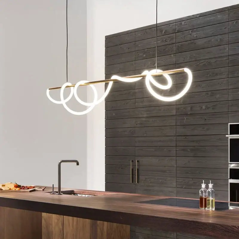 Modern minimalist pendant light with sleek brass rod and glowing white led coils for dining room contemporary led chandelier