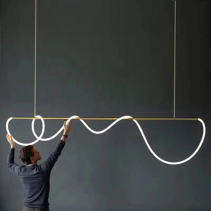 A decorbites™ contemporary led chandelier with a gold frame and white glowing long hose led for dining room lighting
