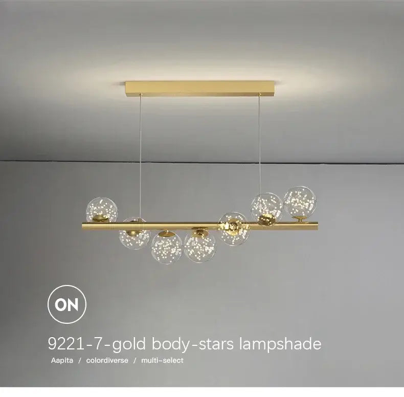 DecorBites™ contemporary led glass ceiling chandelier with gold-toned bar and seven clear globe shades with star sparkles