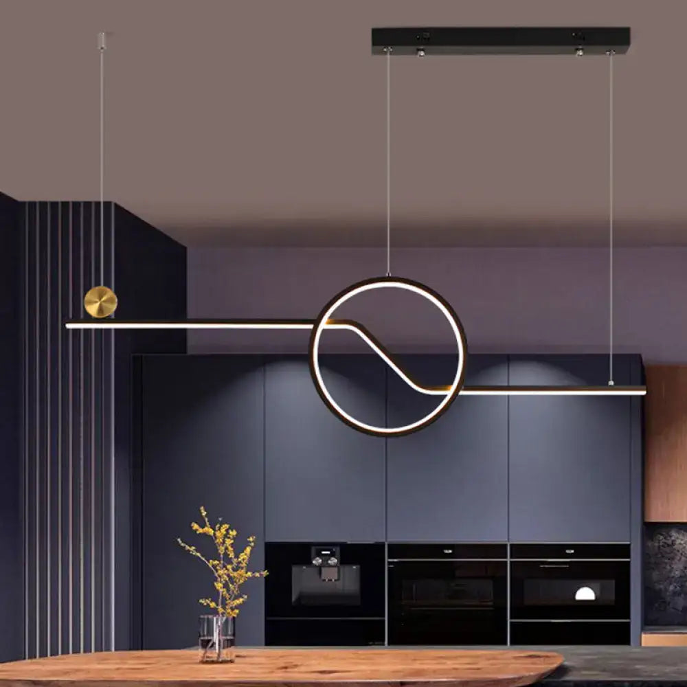 Modern black and gold metal ceiling light by DecorBites with sleek circular led island pendant emitting warm white light