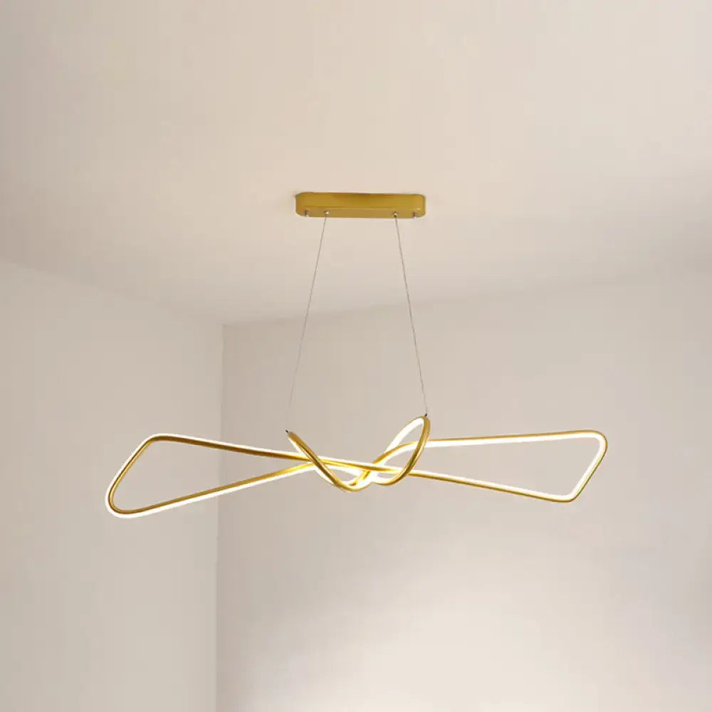 Gold-colored contemporary metal dining room hanging light kit with sleek intertwined bowtie led island design