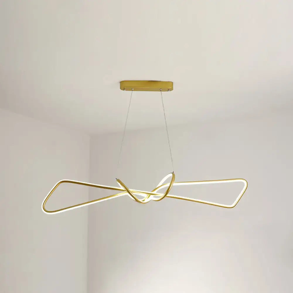 Gold-toned contemporary metal dining pendant light with sleek intertwined design and bowtie led island lighting edges
