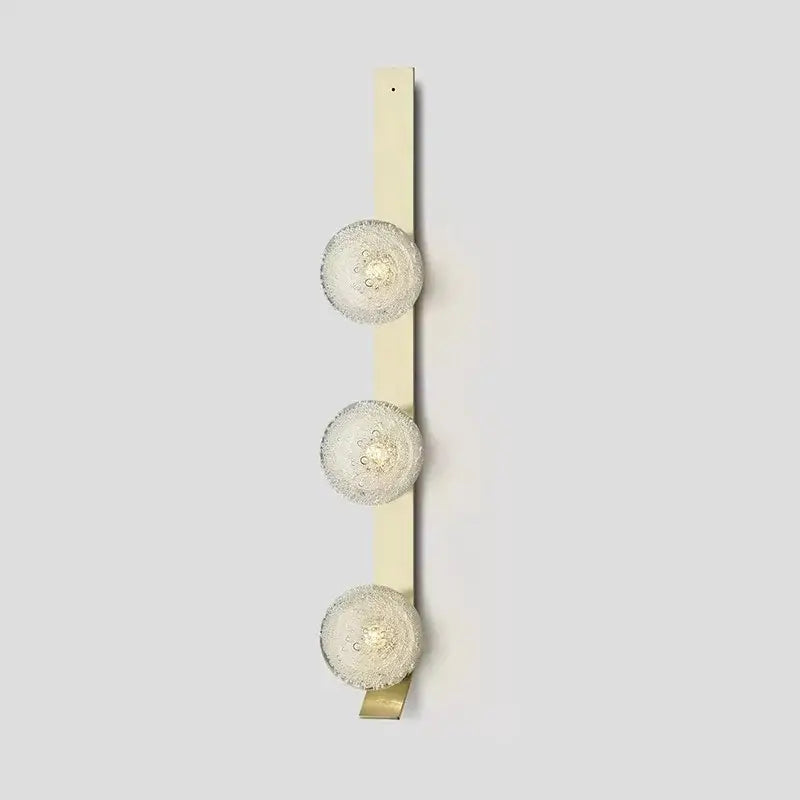 DecorBites™ contemporary wall light with three cream-colored frosted glass spherical bulbs wall-mounted fixture