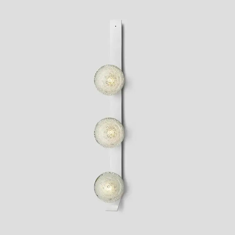 DecorBites™ contemporary wall light with three frosted glass globe bulbs mounted on a white fixture