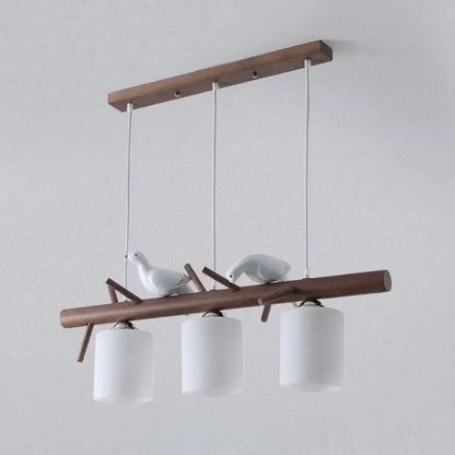 DecorBites contemporary wood island pendant with nutcracker design features cylindrical glass shades and e26 e27 bulbs