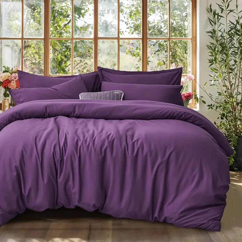 Purple satin-like cotton duvet cover set with subtle texture and elegant folds from DecorBites cooling summer cotton duvet set