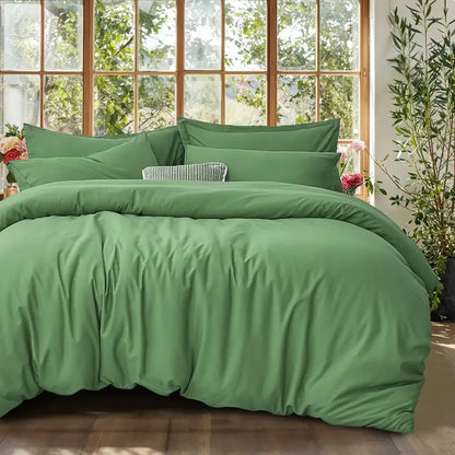 Soft sage green DecorBites™ cooling summer cotton duvet cover set with matching pillows and textured accent pillow