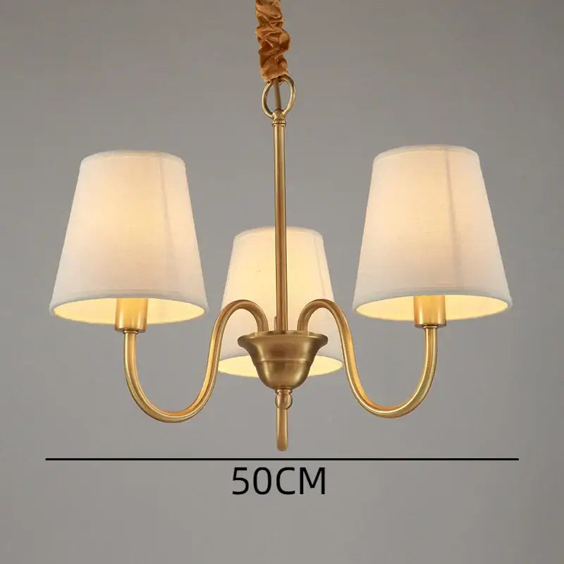 Brass-finished three-arm decorbites copper ceiling chandelier with cream fabric shades for living room lighting