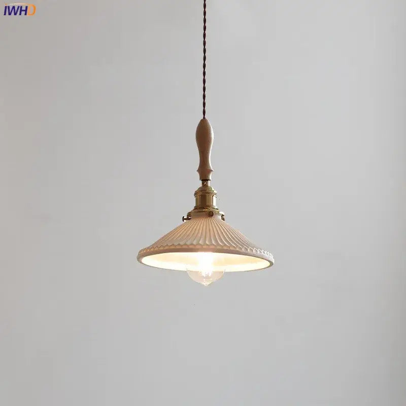 Cream-colored vintage ceramic led pendant lamp with wooden handle brass hardware and ribbed glass shade for kitchen use