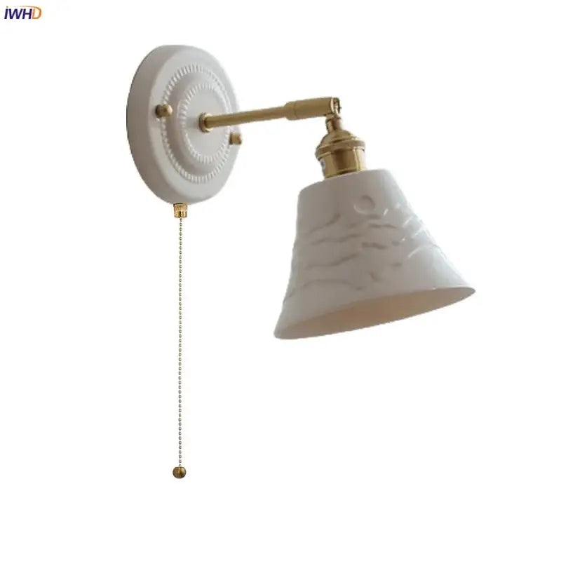 White and gold copper ceramic led wall lamp featuring a textured bell-shaped shade with brass accents for living room