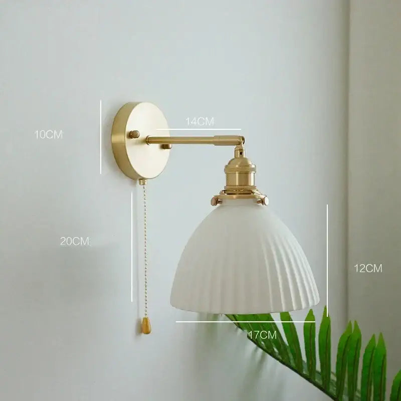 Vintage brass and ceramic led wall sconce with gold-finished brass adjustable arm and white fluted glass shade wall light