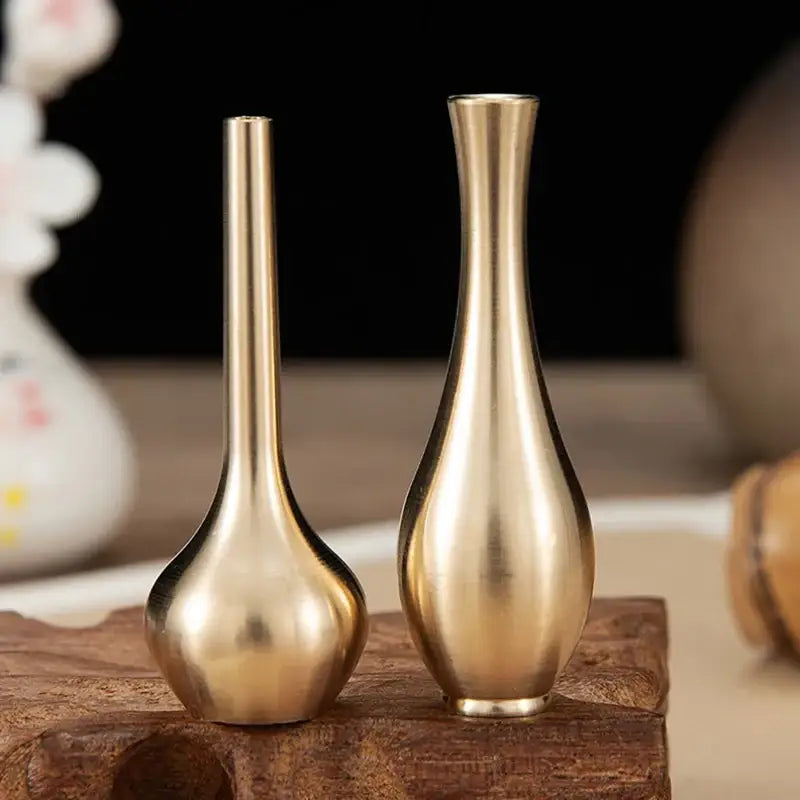 Two elegant brass vases with slender necks and rounded bases as decorbites™ copper gold tall vase home decor accents