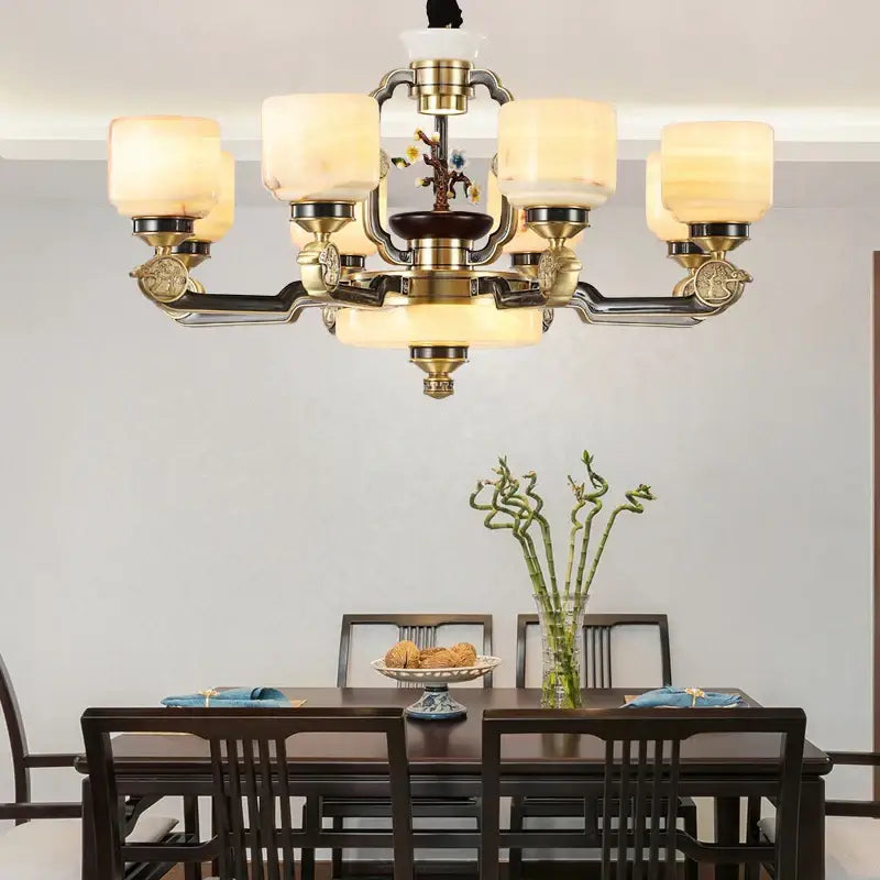 Antique brass decorbites copper jade duplex chandelier with six frosted glass shades and ornate floral motif for living room
