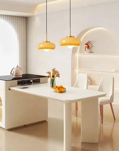 Modern white dining table with sleek minimalist design paired with decorbites copper pendant light fixture