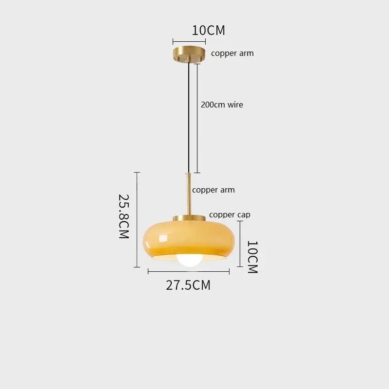 Decorbites™ copper pendant light featuring a warm amber glass shade with brass-finished copper arm and 200cm wire
