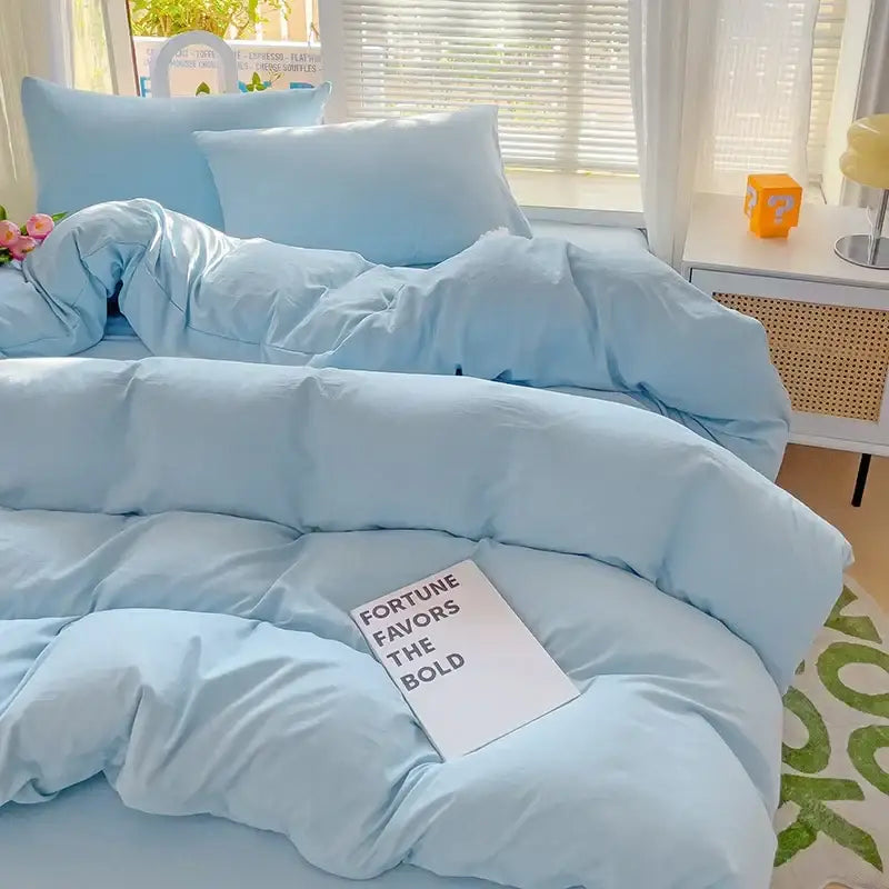 Light blue plush quilted cotton bedding set with matching pillows and duvet cover from decorbites cotton bedding set