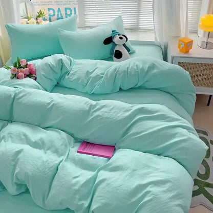 Decorbites cotton bedding set with mint green duvet cover and pillowcases featuring plush stuffed dog on bed