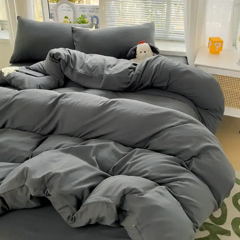 A plush dark gray cotton bedding set with visible stitching lines featuring a soft textured duvet cover