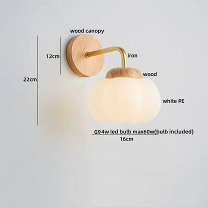 A decorbites cotton led wall lamp with natural wood canopy, brass iron accents, and a white pe glass globe sconce