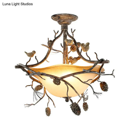 Rustic bronze-finished metal bowl semi flush chandelier with amber glass shade and bird details for bedroom lighting