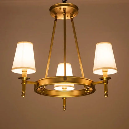 Decorbites country fabric brass chandelier with three warm-toned fabric shades for bedroom lighting