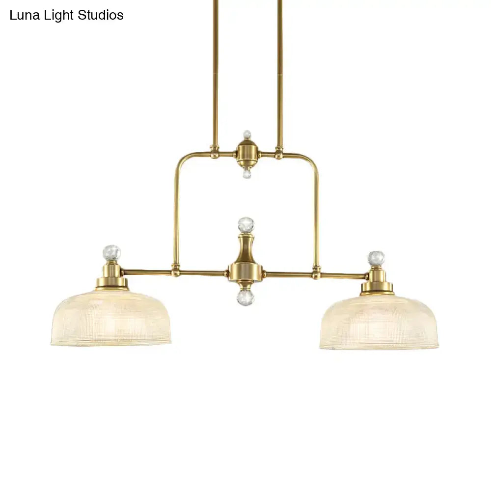 Brass-finished industrial pendant light kit with clear prismatic glass shades and crystal accents for island lighting