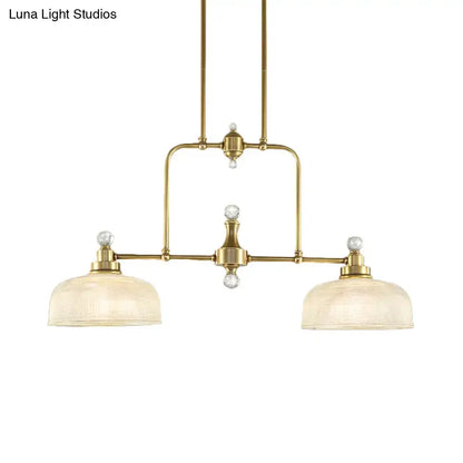 Brass-finished industrial pendant light kit with clear prismatic glass shades and crystal accents for island lighting