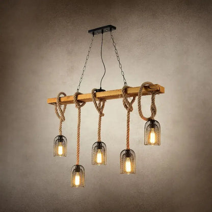 Rustic wooden beam pendant lamp with thick beige rope and black metal countryside mesh hanging cages holding warm bulbs