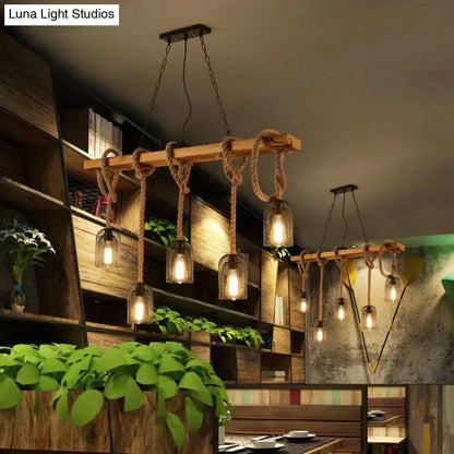 Rustic wooden beam pendant lamp with thick rope suspension and clear glass shades from decorbites countryside mesh hanging collection