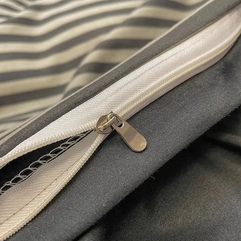 Silver-toned zipper with metallic pull tab on decorbites™ cozy nordic plaid 1pc duvet cover and 1pc flat sheet fabric