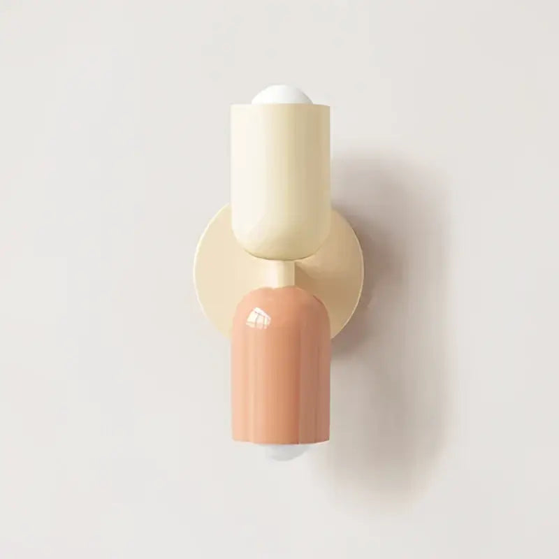 Cream and terracotta wall lamp with minimalist two-part design from decorbites cream double head collection