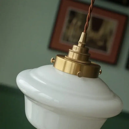 Decorbites cream glass led pendant light with white ceramic shade brass fixture and twisted brown cord for kitchen use