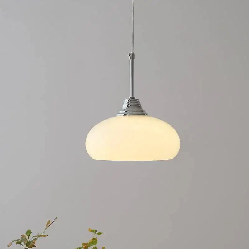 A decorbites cream glass oval pendant light with frosted glass shade and polished chrome hardware for dining room use