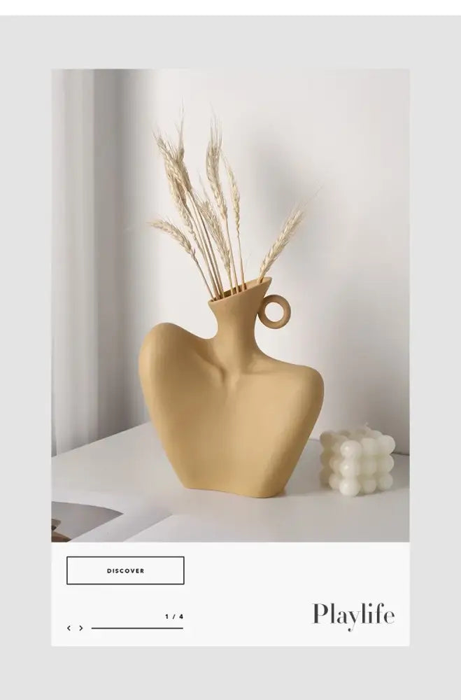 Beige ceramic human vase with stylized bust shape and circular handle for home decor by decorbites