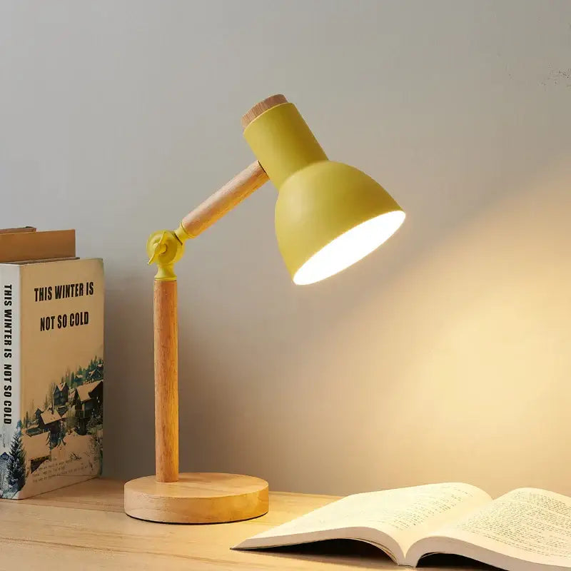 Yellow creative nordic table lamp with wooden base and articulated arm for bedside and study use