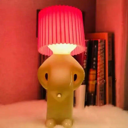 DecorBites creative table lamp featuring a translucent yellow elephant base and vibrant red pleated shade for bedside use