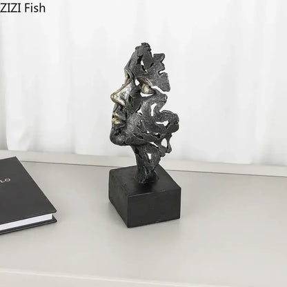 Abstract metallic face sculpture with intricate leaf patterns in dark gray and silver tones for decorbites creative thinker desk decor