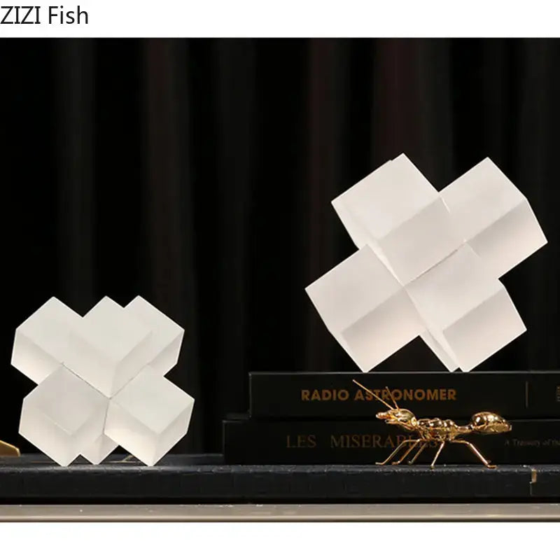 White geometric cube sculptures with translucent frosted finish in decorbites cross crystal black geometric interlocking sculpture