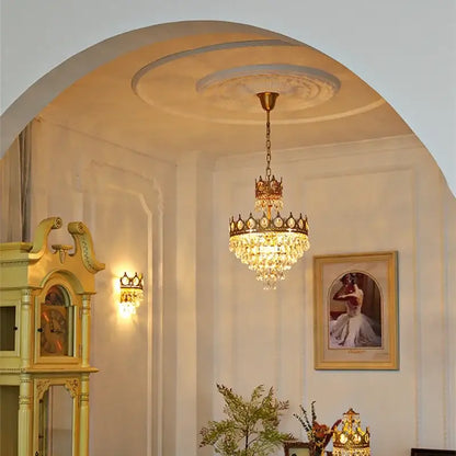 A golden decorbites crown crystal chandelier pendant light with cascading crystal droplets for bedroom decor