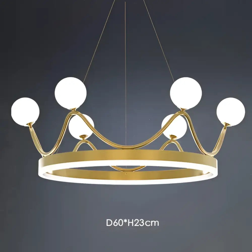 Gold-toned decorbites crown led chandelier with six white glass globes and a circular base for kids room lighting