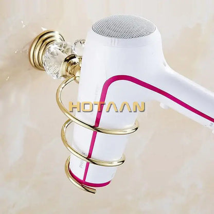 White hair dryer with magenta accent mounted in gold-toned decorbites crystal bathroom spiral stand holder